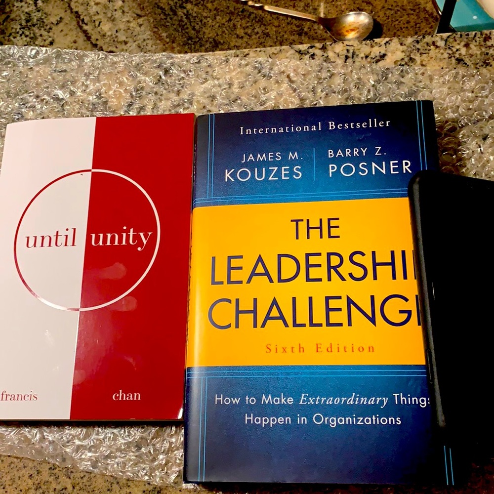 Bundle—2 books and a cracked cell phone